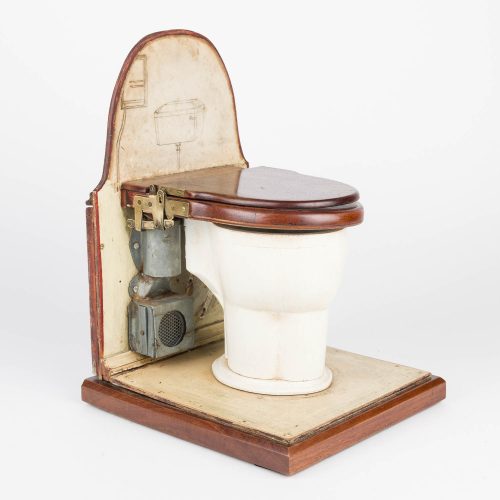 A scale model of a toilet design with extraction fan